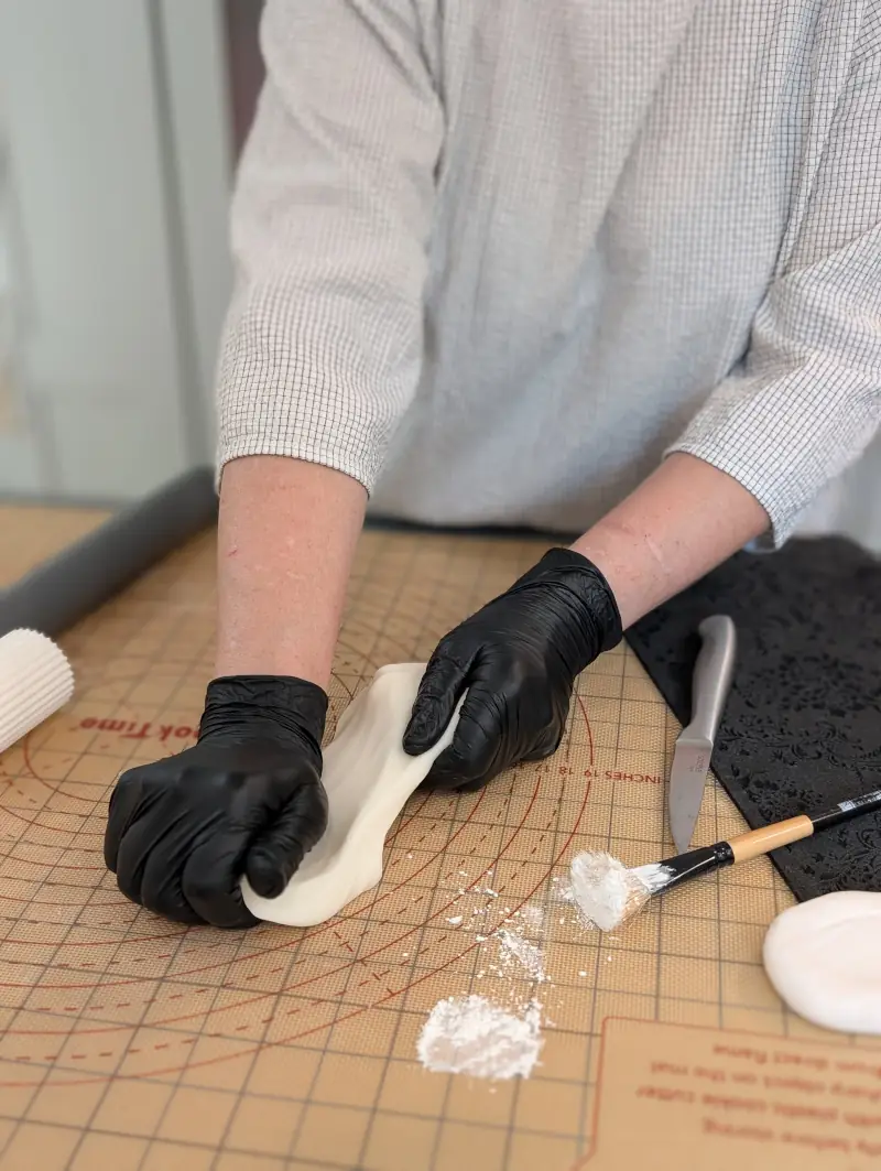 Nadiya kneading and stretching gum paste, by Nadiya's Cupcakes
